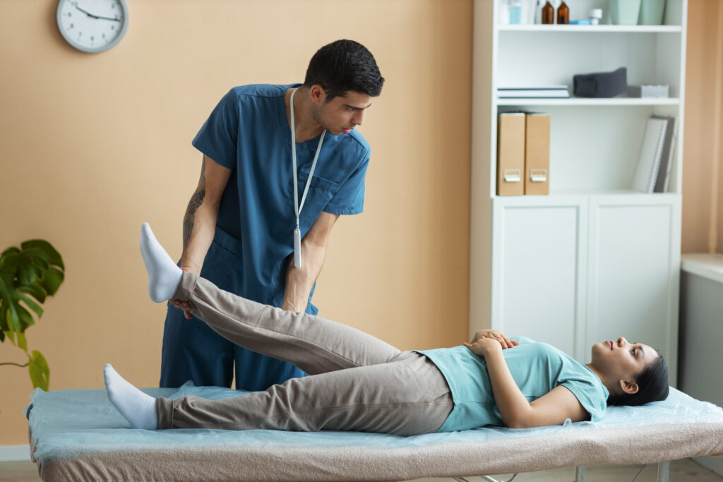 doctor-helping-patient-rehabilitation How Much Does Chiropractor Cost Without Insurance